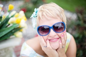happy woman wearing blue sunglasses