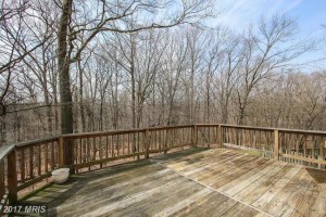 large deck with wooded views