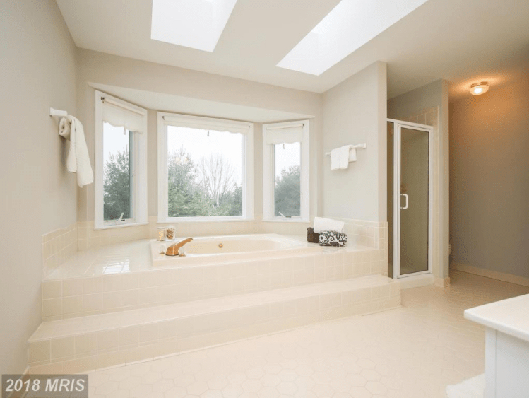 Spa-like bathroom with huge elevated tub.